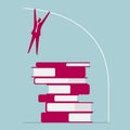 Businessman pole vaulted over books.